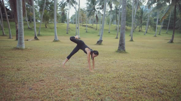 Asian Woman Meditating in the Jungle alt