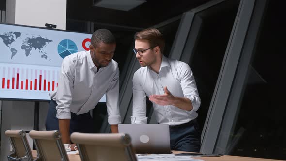 Successful professionals finished working in evening modern office alt