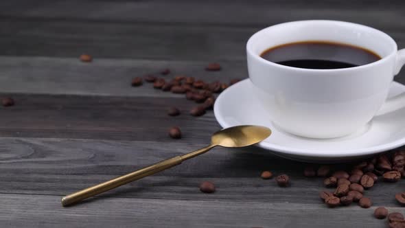 White Cup with Black Coffee on a Dark Wooden Background alt