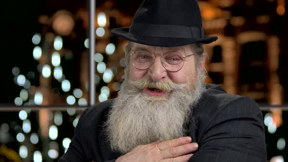 Close Up Expressive Senior Man Talking to Camera alt