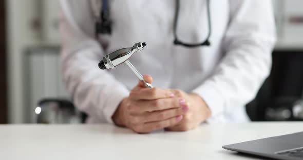 Doctor Neurologist Holding Percussion Hammer in Clinic Closeup  Movie alt