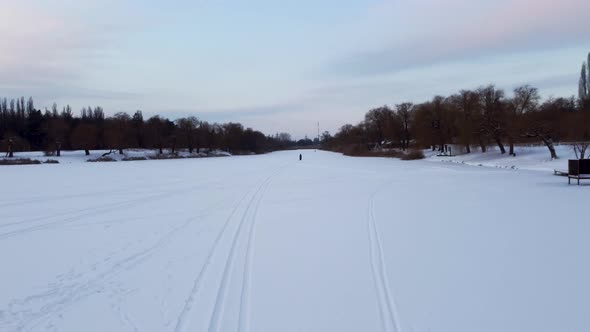 Cross-country wild ski track lines on snowy river