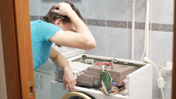 Man Fixes Washing Machine Repairs Broken Destroyed