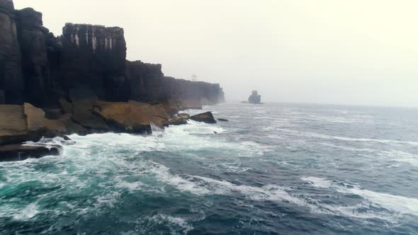 Aerial View Steep Coast of Atlantic Ocean in Foggy Morning