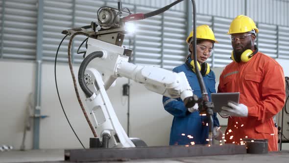 industrial 4.0 concept modern automated robot welding arm machine tool alt