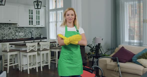 Woman-Worker of Cleaning Company Standing in front of Camera with Crossed Arms alt