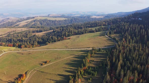 Highlands and Hills with Narrow Roads and Autumn Forests alt