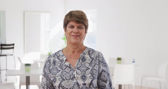 Portrait of a happy Caucasian senior woman spending time before her ballroom dancing class alt