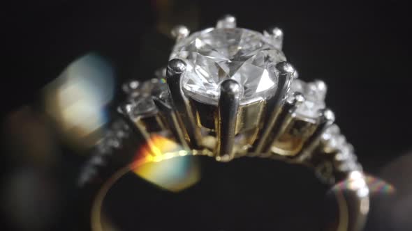 Extreme Detailed of Diamond Ring Close Up Shot While Rotating on Dark Background alt