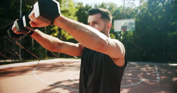 Fit Man Working Out with Dumbbells alt