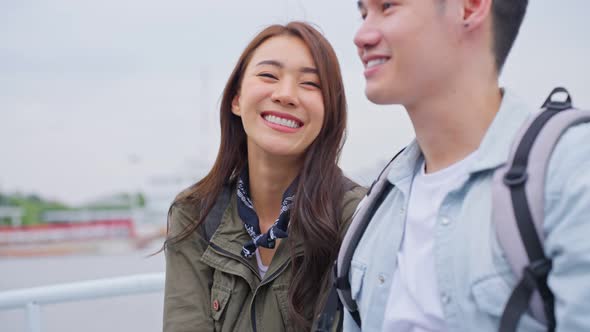 Asian attractive romantic couple travel in the city for honeymoon trip. alt