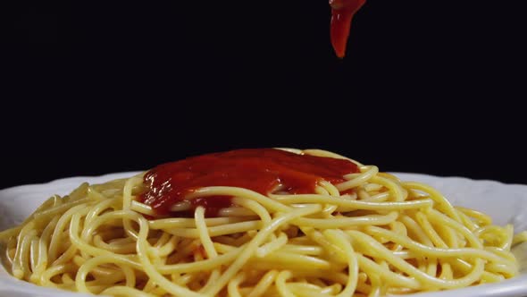 Pouring Tomato Sauce On Pasta 77