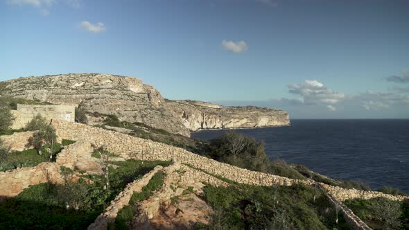 Fences Made From Stones on the Top of Blue Grotto Caves During Golden Hour Time in Malta