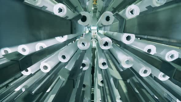 Paper Rolls Inside of a Moving Factory Machine alt