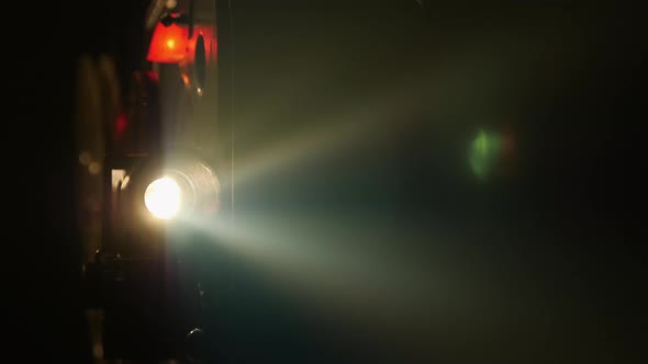 Old Film Projector Shows a Film, Close-up alt