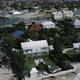 Aerial camera whirls above colonial houses in Cockburn Town, Turks and Caicos - VideoHive Item for Sale