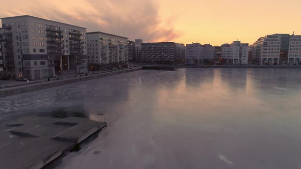 Drone Shot Flying Over Ice and Over Apartment Buildings