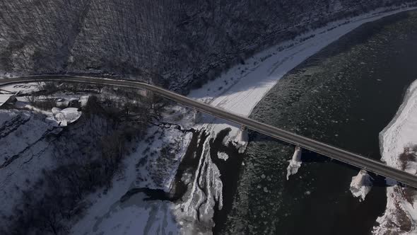 Frozen Canyon with Bridge at Winter Day Aerial Drone View