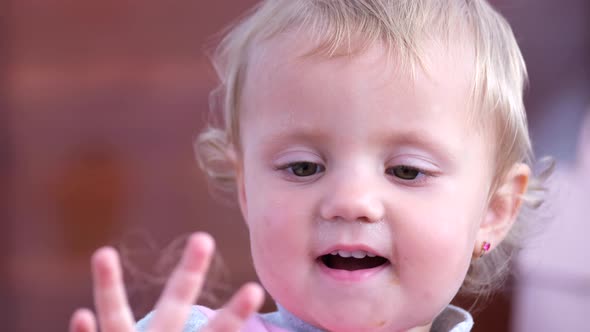 The Little Girl is Smiling She Has a Happy Childhood alt