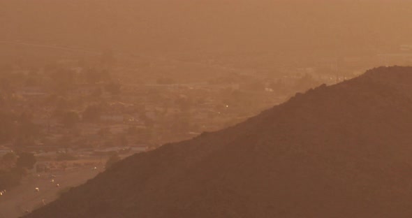 Helicopter aerial shot moving from fog to motor boat on ocean, foggy day
