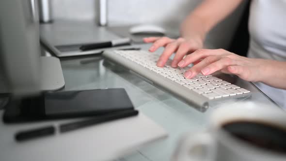 Technology Concept Close Up Hands of Unrecognizable Woman Sitting in Front of Computer with Coffee