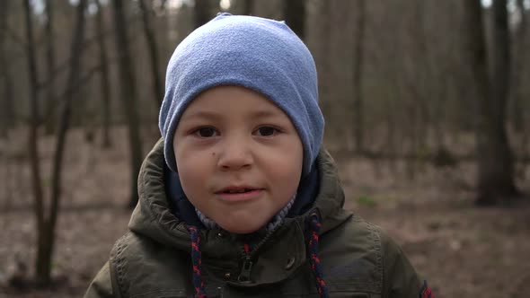 Boy Eating Cookies in the Forest, Close-up,slow-mo