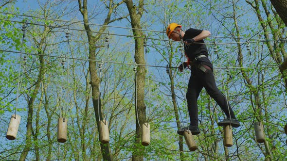 A high-ropes course in an adventure park alt