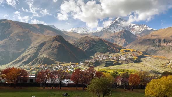 Mountain Kazbek Mkinvartsveri and Town Stepantsminda Autumn Colors of Georgia alt