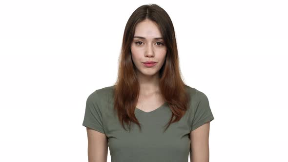 Portrait of Attractive Woman 20s in Casual Tshirt Gesturing Finger on Camera Meaning Hey you Over alt