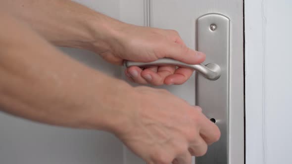 The Man Opens the Door with a Key and Opens for Entry and Exit alt