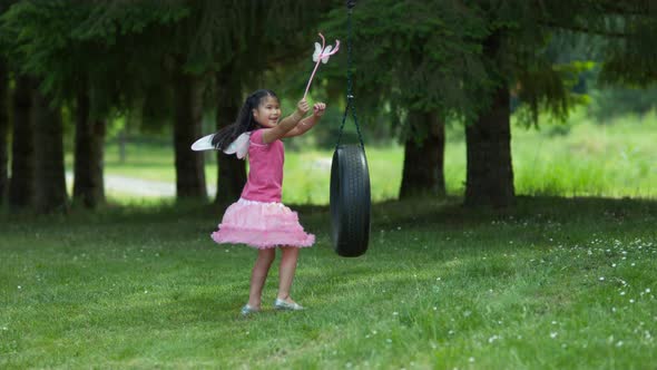 Girl in fairy princess costume on tire swing, shot on Phantom Flex 4K alt