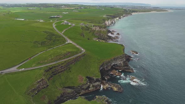 Ireland Ocean Coastal Meadows Aerial View Road with Cars at Green Landscape alt