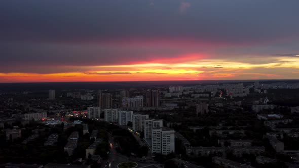 Epic aerial sunset in city district houses rooftop