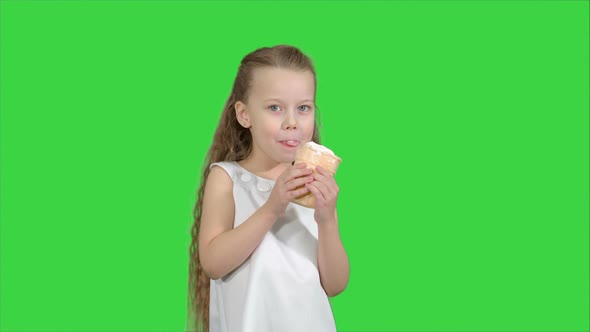 Kid Girl Eating with Ice Cream on a Green Screen, Chroma Key alt