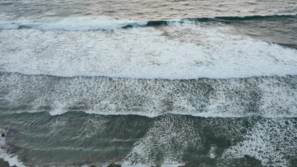 Scenic Waves of Indian Ocean Waves on Sunset Bali   Wide Shot Handheld Top View