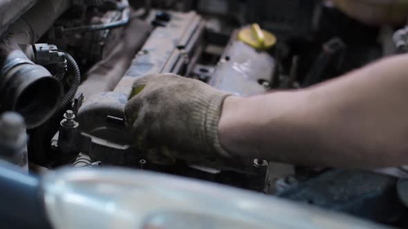 Car mechanic working in service center