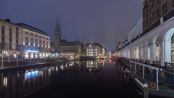 Night to Day Time Lapse of town hall with fog, Hamburg, Germany alt