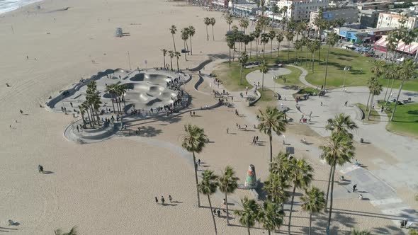 Aerial of a park and a skatepark on the beach alt