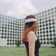 A woman in the city trying on vr glasses - VideoHive Item for Sale