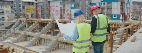 Engineers Checking Blueprints