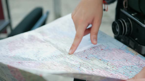 tourist Woman's hand pointing to the map Close up