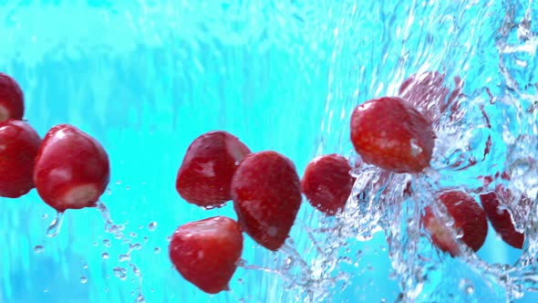 Strawberry Splashing Into Water Pouring Down In Slow Motion 4k alt