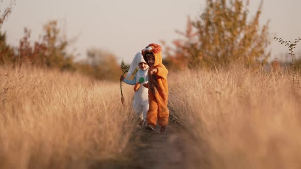Cute Children Having Fun  Boys Runs on Autumn Nature Background alt