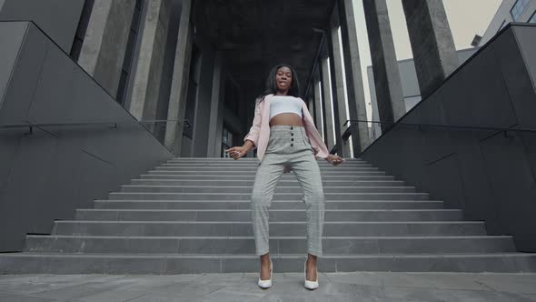 Young Black Girl Dancing Modern Dance On The Stairs alt