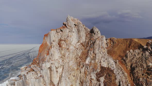 Aerial View of Winter Landscape of Rocky Mountains on Lake Baikal. alt