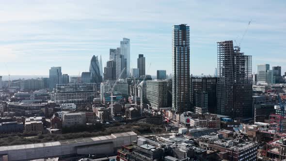 Rising drone shot of City of London from shoreditch alt
