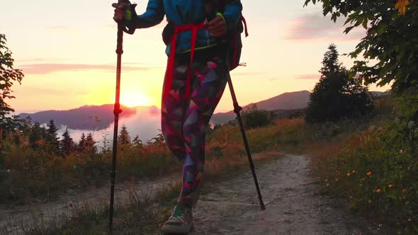 Woman Nordic Walk In Scenic Nature At Sunset