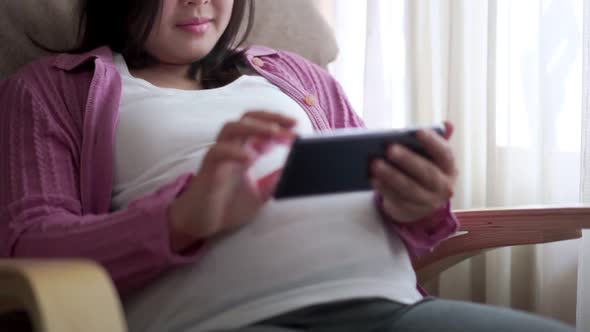 Happy Pregnant Woman and Expecting Baby at Home alt