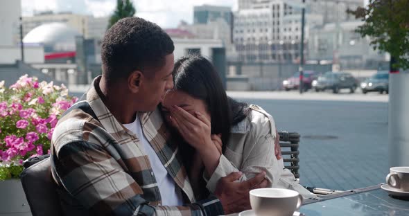 Frustrated Asian Woman Cries Covering Her Face with Her Hands Talks About Her Feelings to Her alt