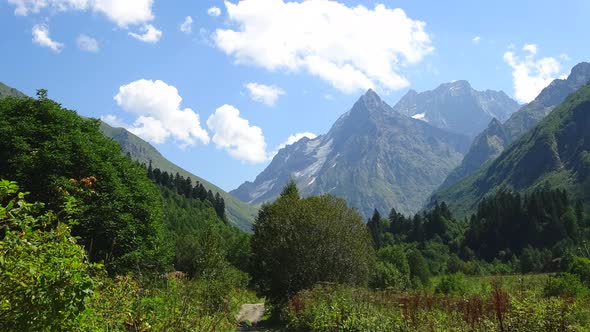 Timelapse in mountains with beautiful clouds moving fast in national park of Dombay